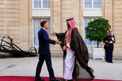 Saudi and French leaders greet each other during an official meeting in Paris