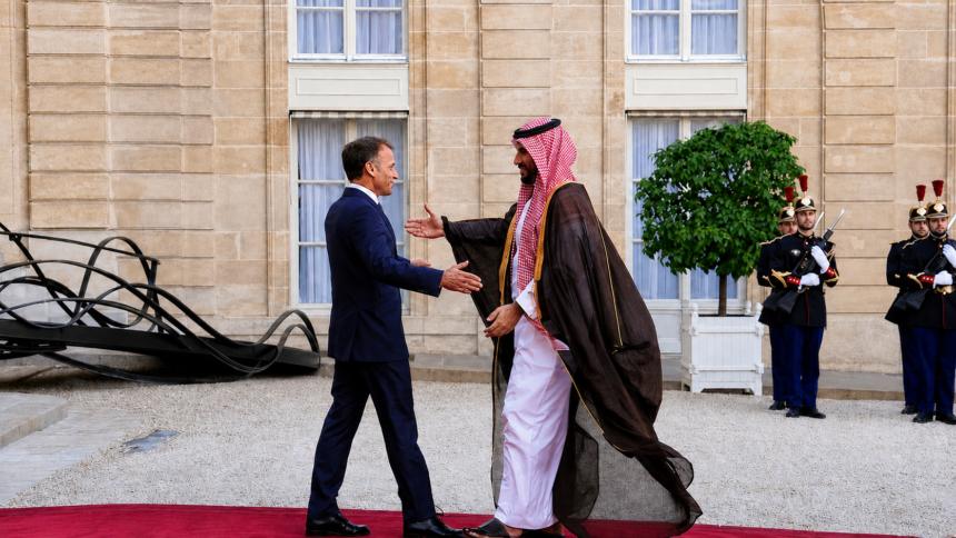 Saudi and French leaders greet each other during an official meeting in Paris